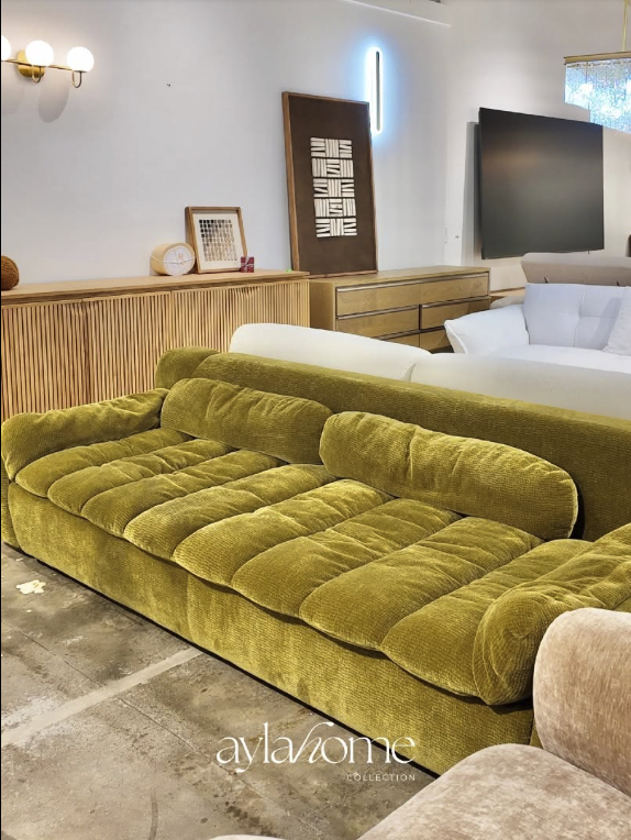 Olive velvet accent sofa in the Ayla Home Collection San Jose showroom