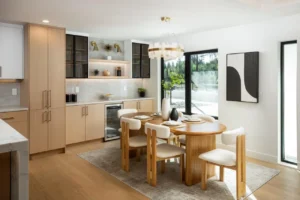 Bright Los Gatos dining area with a round wood table and light upholstered chairs