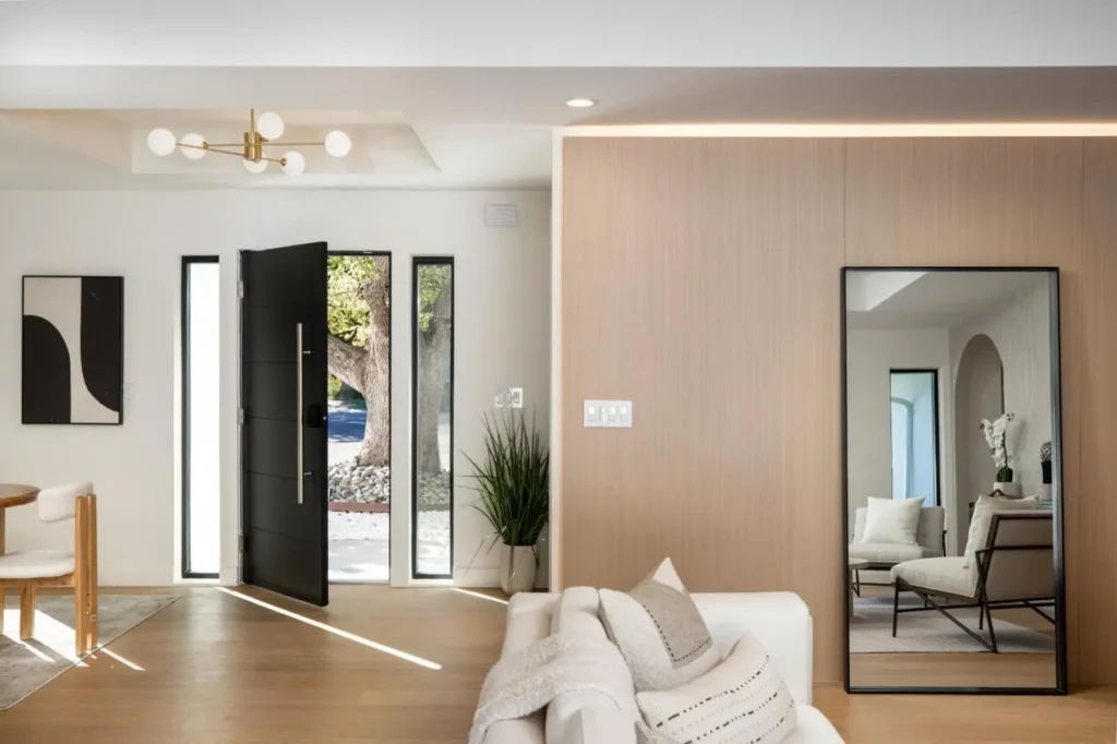 Bright furnished entry and living area prepared for welcoming guests
